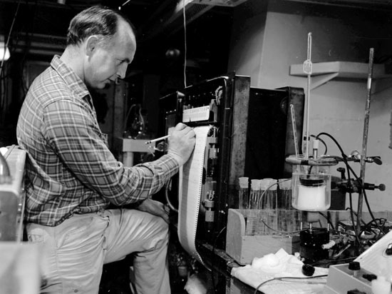 Stanley Watson monitors the oxygen uptake of microbes in a seawater sample during a 1961 Chain cruise.