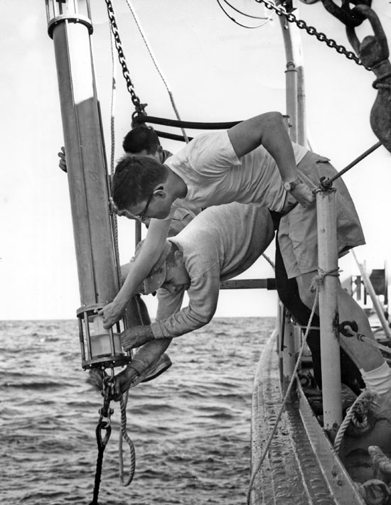 An electronic current meter goes over the side of Crawford in 1965. Development of modern, long-lived current meters was vital to progress in Gulf Stream research. (WHOI Archives Photo)