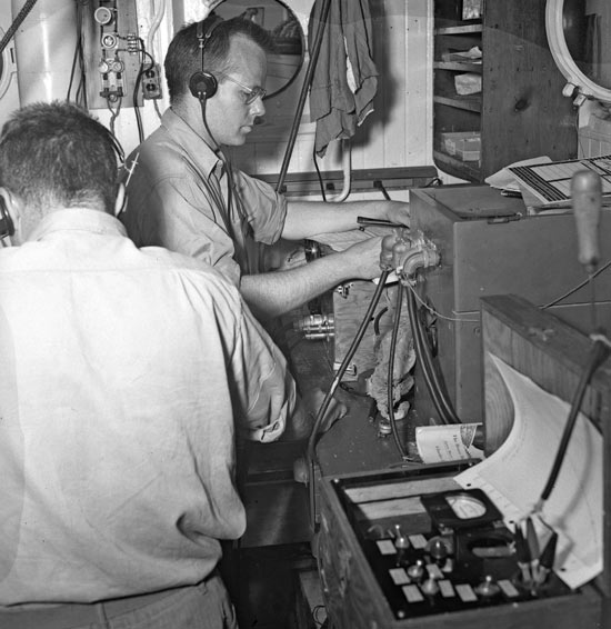 Brackett Hersey tests electronic gear in the upper lab aboard Atlantis